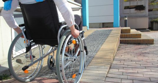 woman_in_wheelchair_using_ramp-1200x627